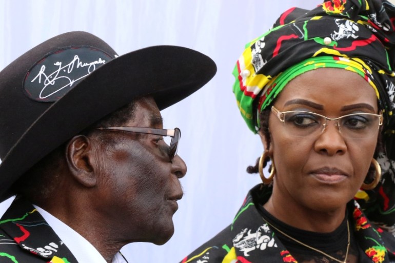 President Robert Mugabe and his wife Grace attend a rally of his ruling ZANU (PF) in Chinhoyi