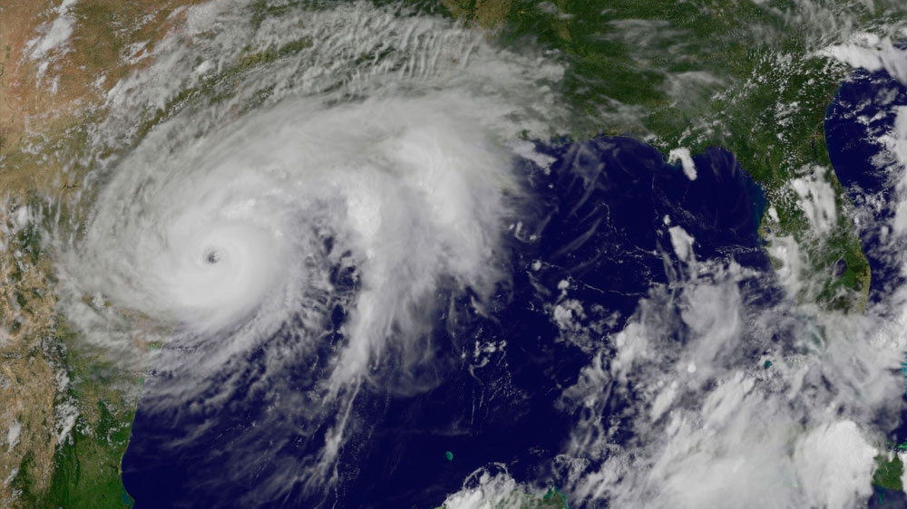 This enhanced satellite image shows Hurricane Harvey, middle left, approaching the coast of Texas on Friday [NASA/NOAA via AP]