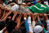People in the village of Gabarpora carry the remains of Akeel Ahmad Bhat, a civilian who died following clashes between Kashmiri fighters and Indian security forces [Danish Ismail/Reuters]