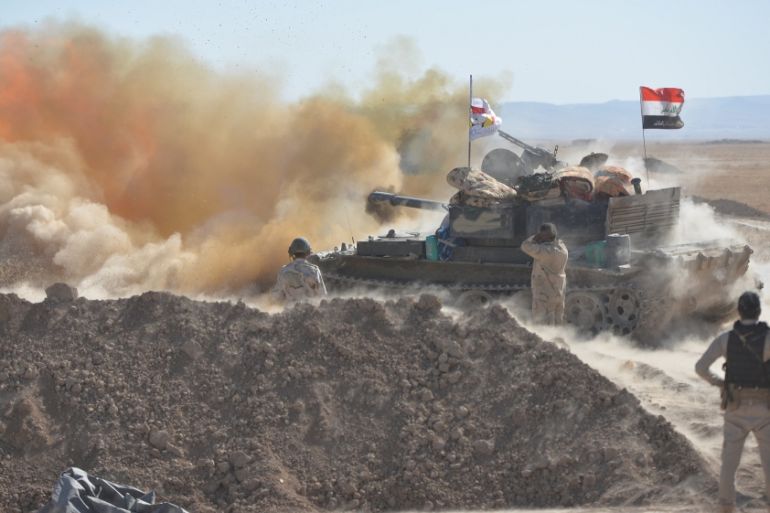 Iraqi army fire against Islamic State militants on the outskirts of Tal Afar