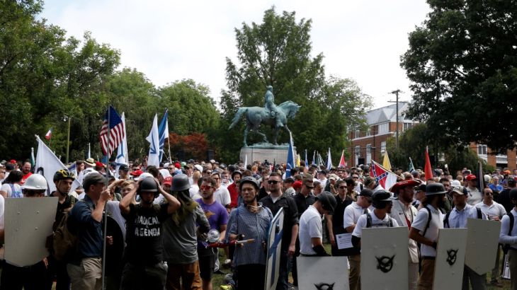 White supremacists gather under a statue of Robert E. Lee during a rally in Charlottesville, Virginia