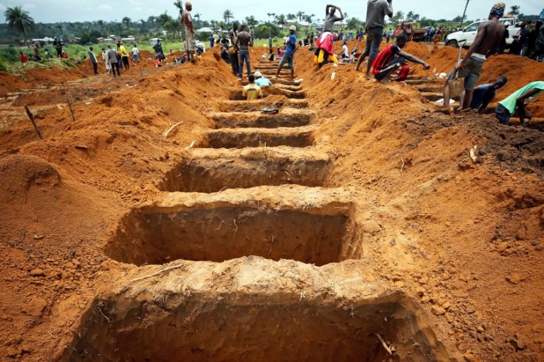 Workers are digging graves at the Paloko cemetery in Waterloo - Sierra Leone