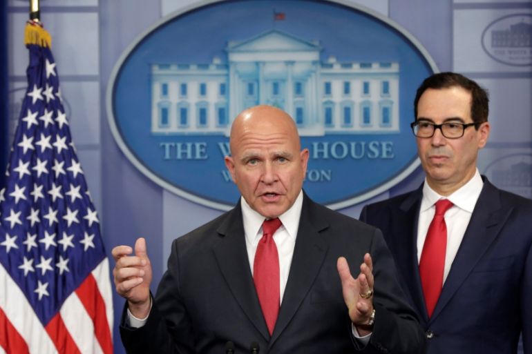 U.S. Treasury Secretary Mnuchin listens to National Security Adviser McMaster speak during a briefing at the White House in Washington