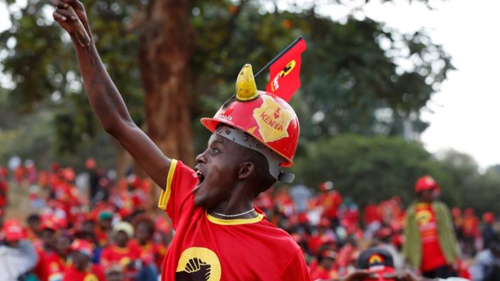 A supporter of Kenya''s President Uhuru Kenyatta reacts during a Jubilee Party campaign rally at Uhuru park in Nairobi, Kenya