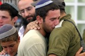 Jewish settler cries as he embraces an Israeli soldier during the evacuation of Netzarim settlement in the Gaza Strip on August 22, 2005 [Dan Balilty/Daylife]