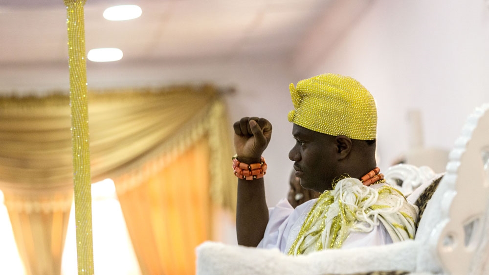 
King Adeyeye Enitan Ogunwusi meets visitors in the main hall [Andrew Esiebo/Al Jazeera]
