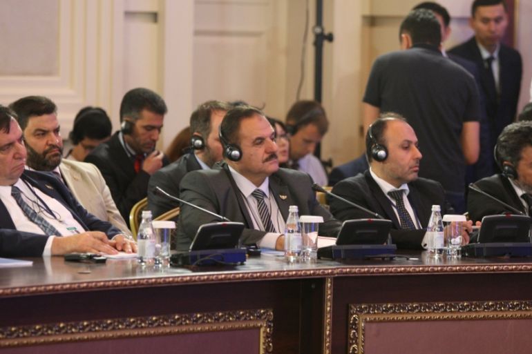 Members of the Syrian opposition delegation attend the round on Syria peace talks in Astana