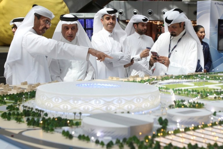 Qatar Airways Chief Executive Akbar al-Baker looks at a model of Al Thumama stadium during an unveiling ceremony at Hamad International Airport in Doha