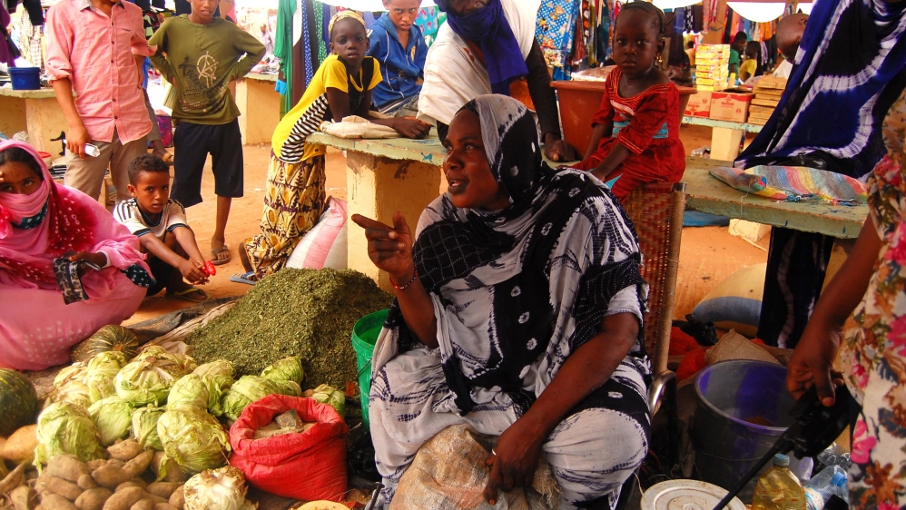 Originally from the town of Lere in the Timbuktu area of Mali, Modiere Coulibaly sells vegetables in the camp market every Tuesday [Jillian Kestler-D'Amours/Al Jazeera] 