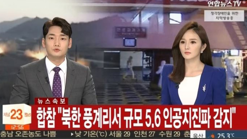South Korean newsreaders of the Yonhap agency report on the latest developments [Reuters]