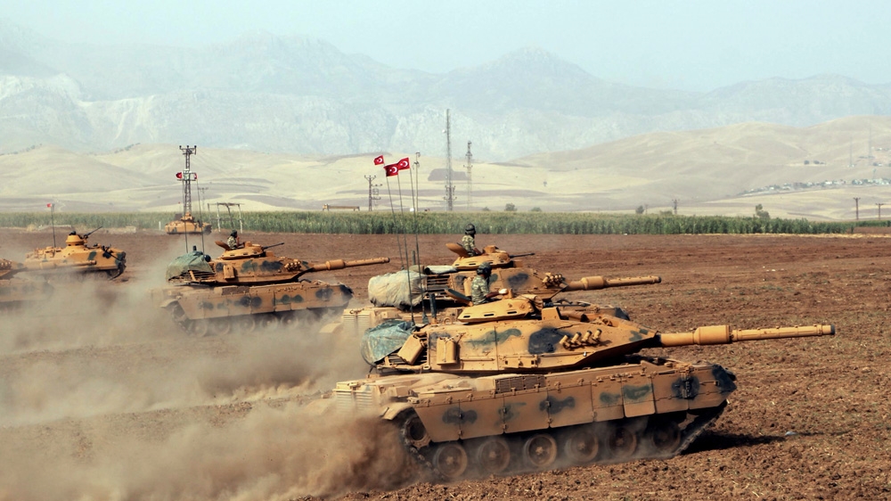 Turkish army tanks prepared for exercises in Silopi, near the Habur border gate with Iraq, southeastern Turkey, on Monday [DHA-Depo Photos via AP]