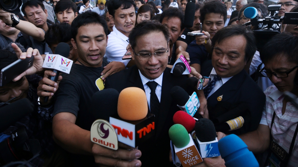 Sommai Koosap, lawyer of former Thai Prime Minister Yingluck Shinawatra, speaks to the media as he arrives at the Supreme Court in Bangkok [Reuters]