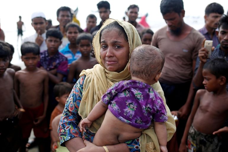 A Rohingya refugee woman cries after crossing the Bangladesh-Myanmar border