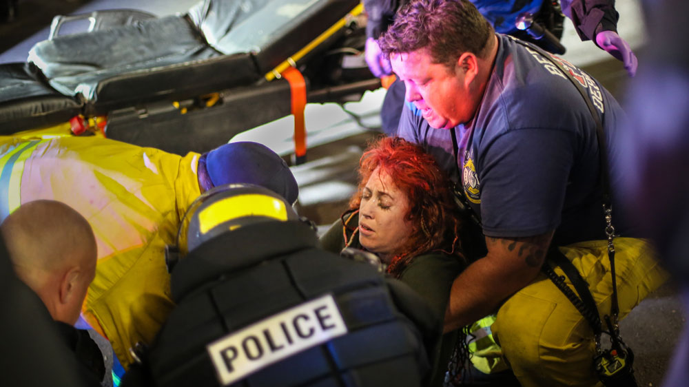A woman is injured at the end of the night [Walker Dawson/Al Jazeera]
