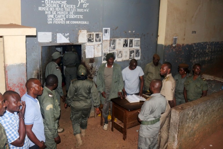 Security forces stand during the release of Anglophone activists at the prison of Yaounde,Cameroon,