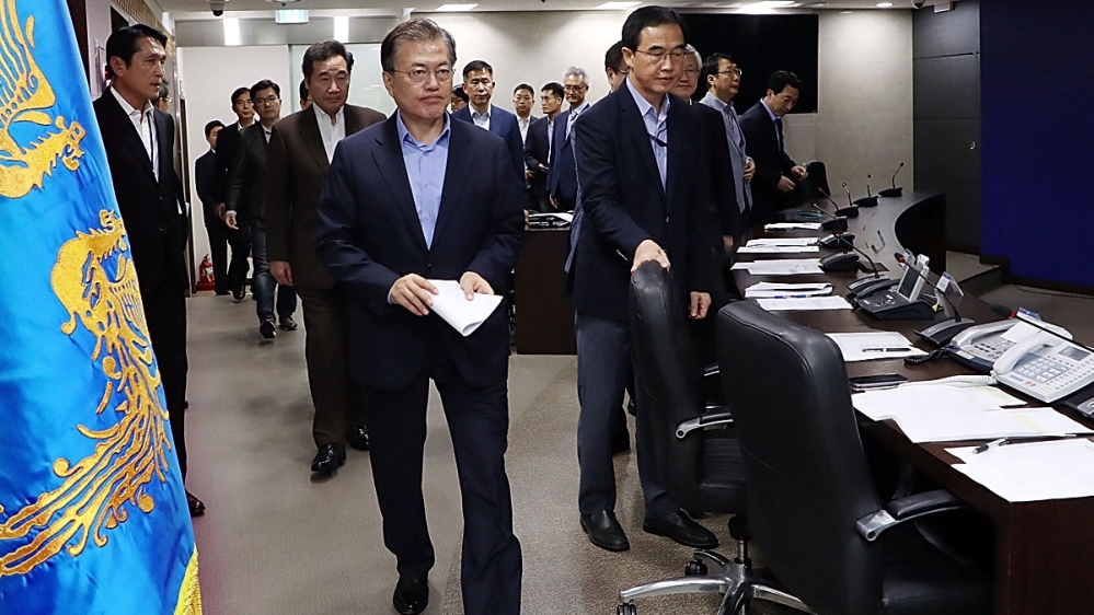 South Korean President Moon Jae-in arrives for the meeting of the National Security Council at the presidential Blue House [South Korean Presidential Blue House via Getty Images]