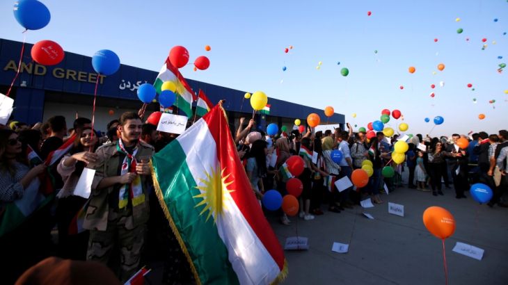 Kurdish people protest outside the Erbil International Airport in Erbil