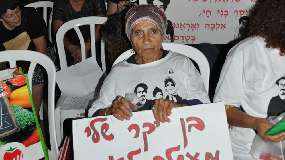 Tamar Maatuf at Monday's rally against the theft of Mizrahi babies in the '50s [Yuval Abraham/Al Jazeera] 
