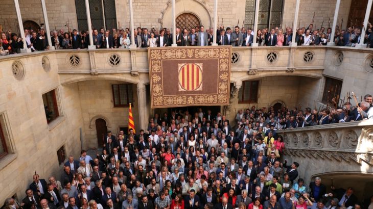 Mayors of towns of Catalonia that support the Referendum of 1-O raise up their scepters as they shout "we will vote" at Palau de la Generalitat in Barcelona
