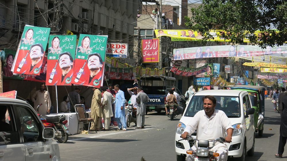 The sprawling NA-120 constituency turned into a riot of colourful banners and rallies throughout the spirited campaign [Asad Hashim/Al Jazeera]