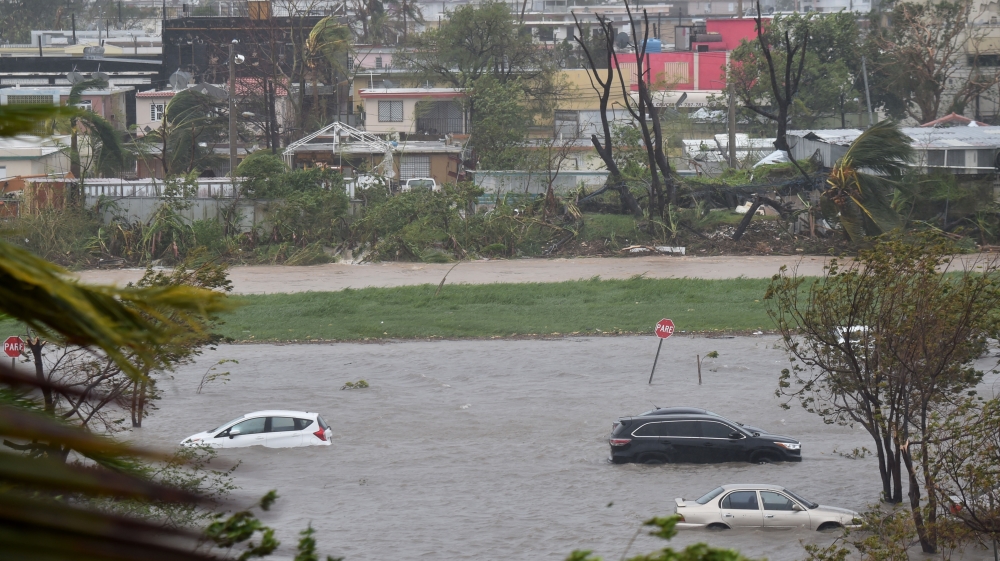 A flooded car park near Roberto Clemente Coliseum in San Juan [Hector Retamal/AFP/Getty Images]