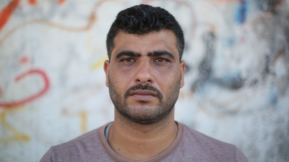 Ahmed al-Sayis, 35, is a taxi driver [Ahmed Abdelal/Al Jazeera]