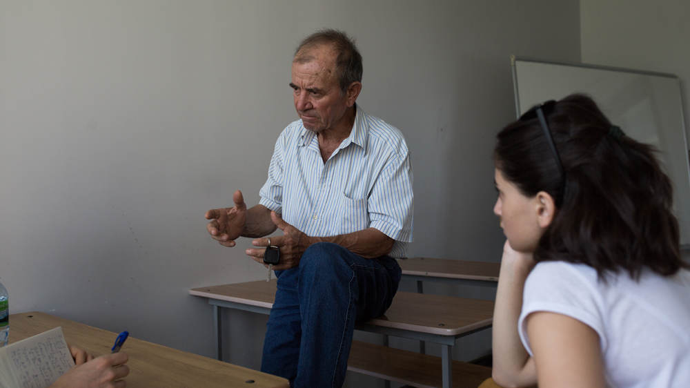 Munir Kudzhba teaching an Arabic class at Abkhazia State University [Alice Aedy/Al Jazeera]