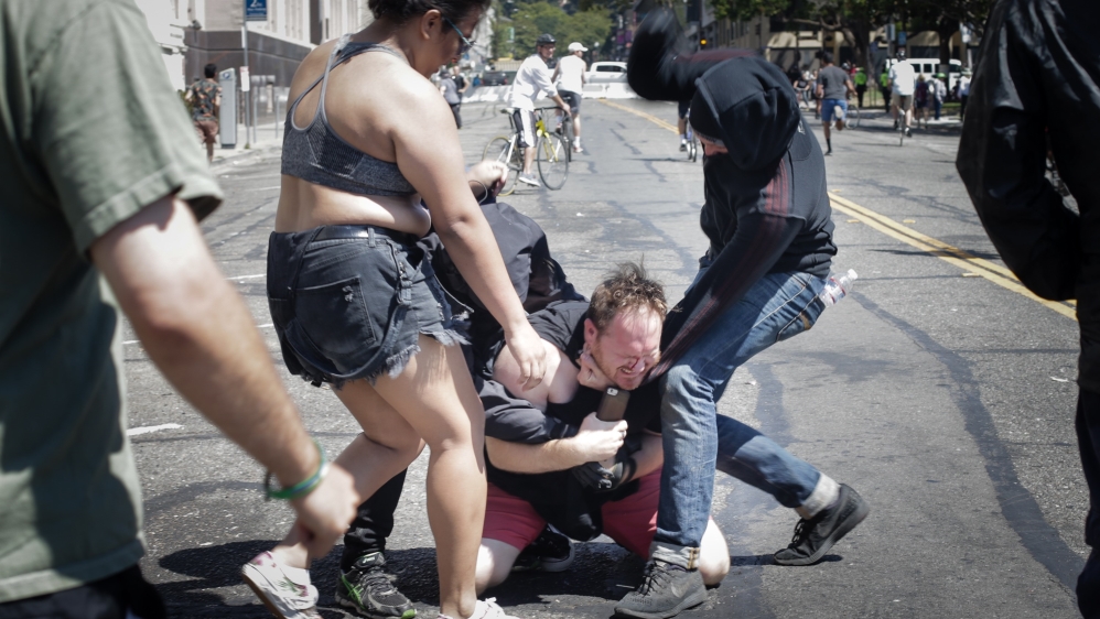 Anti-fascists clash with a far-right demonstrator in Berkeley, California in late August [File: Elijah Nouvelage/Getty Images/AFP]
