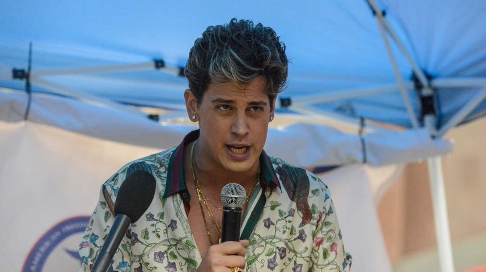Milo Yiannopoulos speaks at anti-Muslim protest in New York City in April [File: Photo by Stephanie Keith/Getty Images]