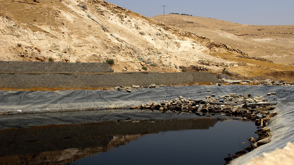 The liquid waste pool near Wadi Abu Hindi [Jaclynn Ashly/Al Jazeera]
