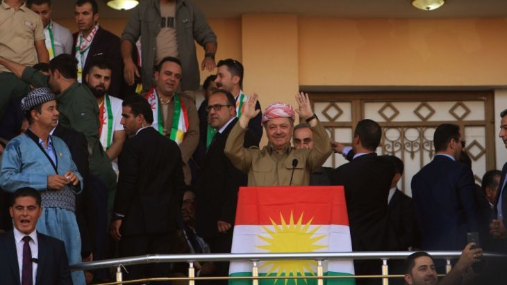 Iraqi Kurdish President Masoud Barzani salutes the crowd while attending a rally to show their support for the upcoming September 25th independence referendum in Duhuk