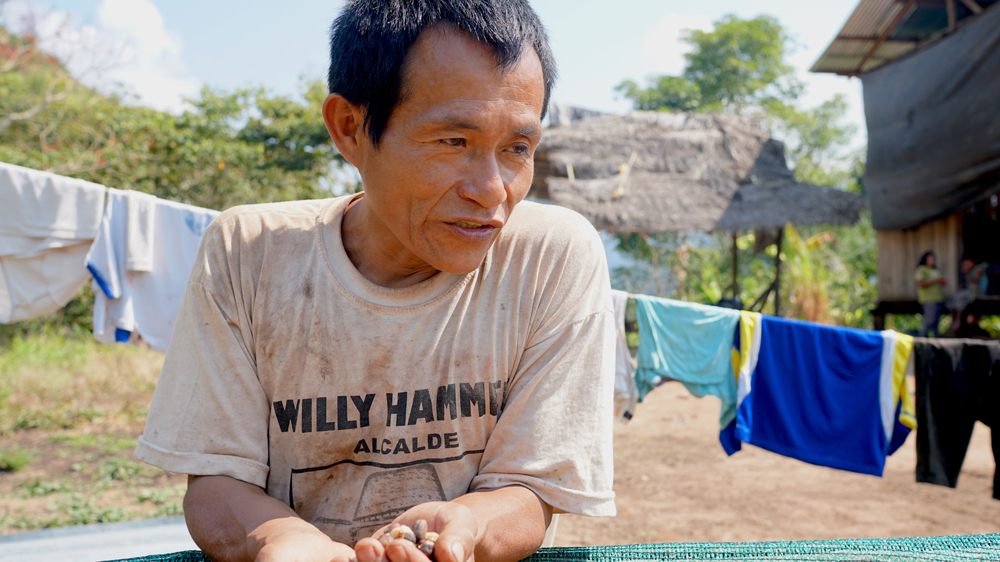 Indigenous coffee farmer Misael Amaringa was left in financial ruin when a leaf blight destroyed his community's coffee plants [Neil Giardino/Al Jazeera]