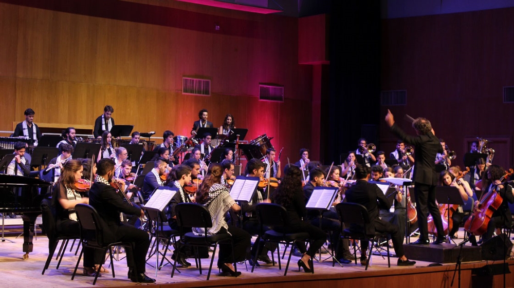 The Palestine Youth Orchestra performed at the Naseeb Azeez Shaheen Auditorium in Birzeit [Nigel Wilson/Al Jazeera]