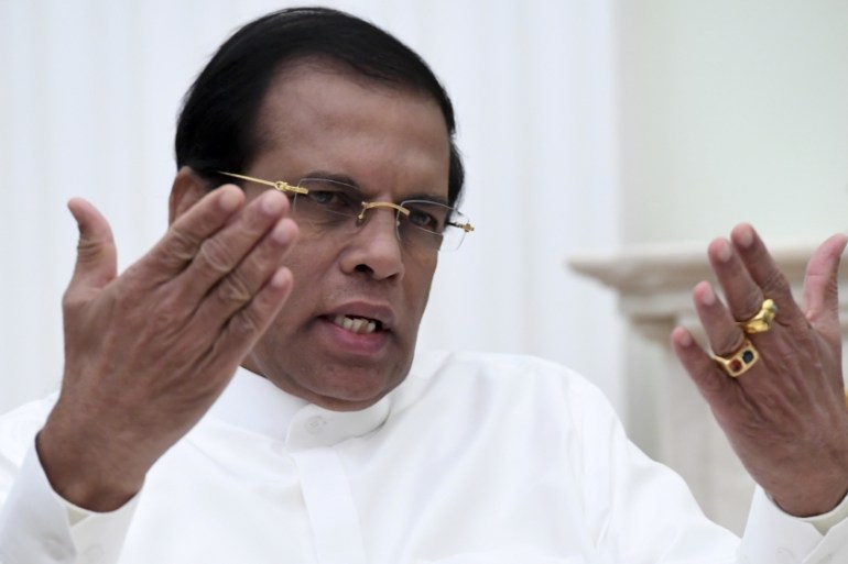 Sri Lankan President Sirisena gestures as he speaks during meeting with his Russian counterpart Putin at Kremlin in Moscow