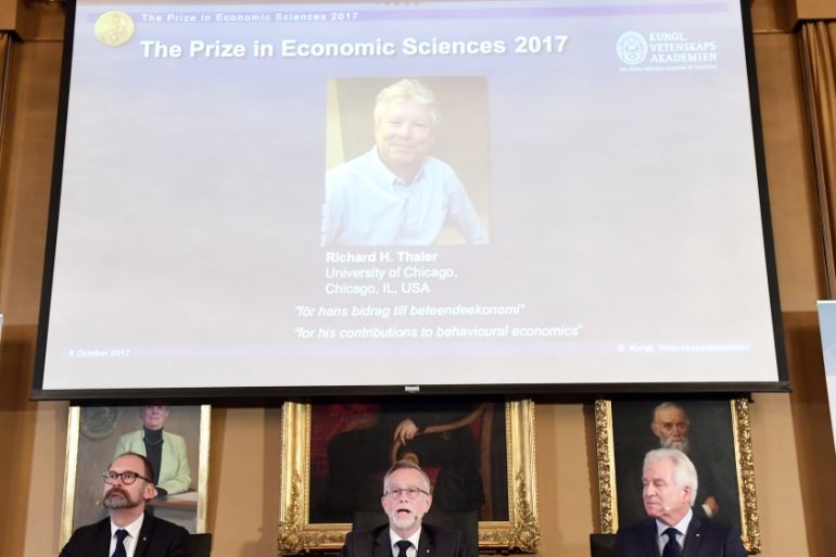 Photo of Richard H. Thaler is displayed on the screen during the announcement of the winner of the Nobel Prize in economic sciences 2017, in Stockholm