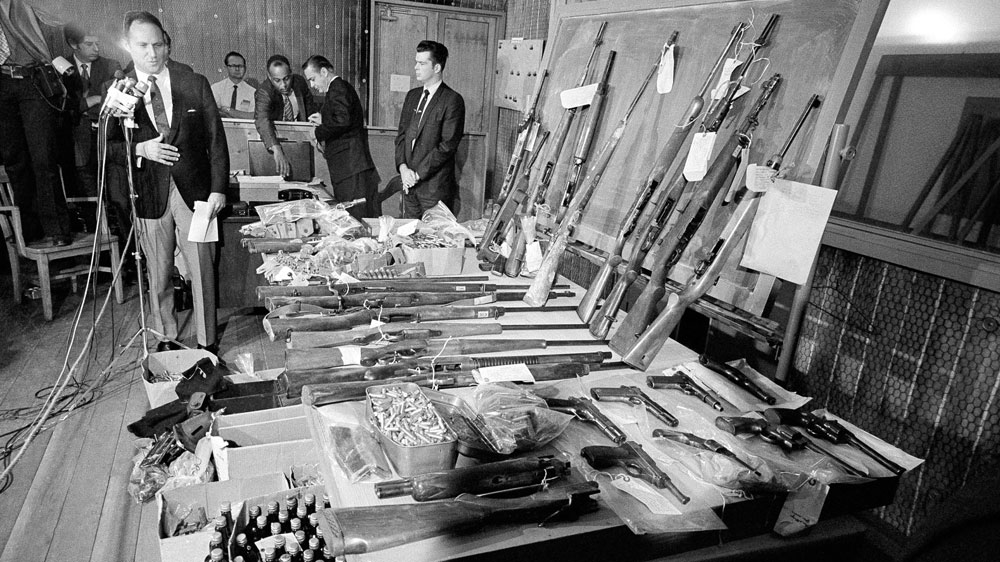 The LA Police Department displays arms it said was confiscated in raids on the Black Panther headquarters in 1969 [File: George Brich/AP Photo]