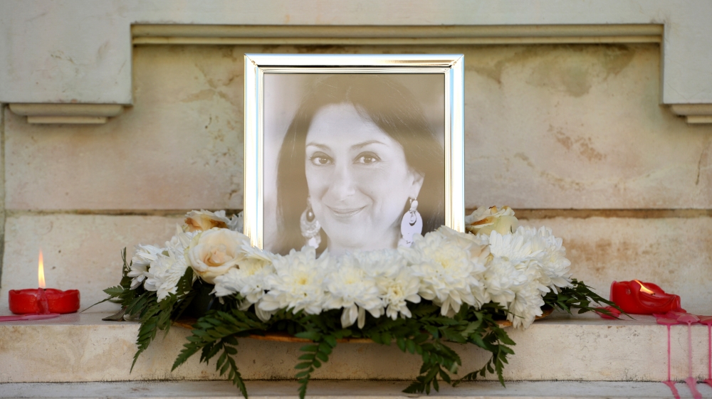 Flowers and tributes for Caruana Galizia lay at the foot of the Great Siege monument in Valletta [Matthew Mirabelli/AFP/Getty Images]