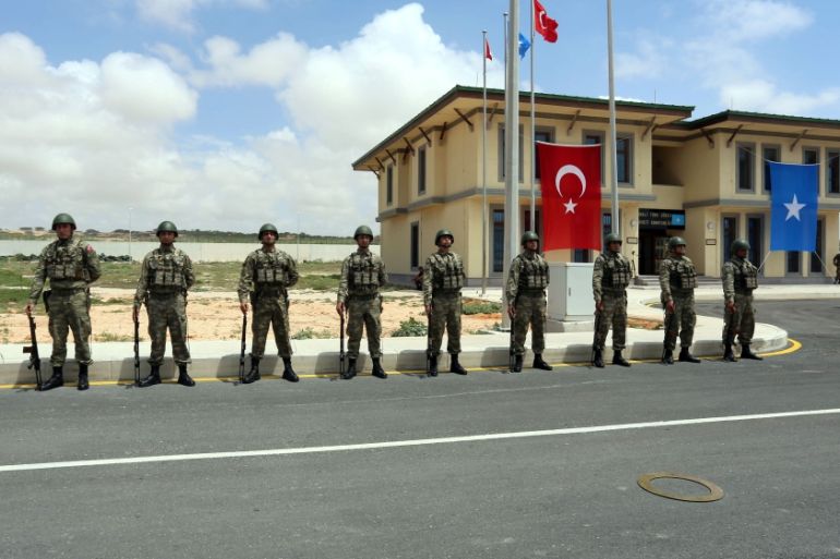 Turkish military officers parade during the opening ceremony of a Turkish military base in Mogadishu