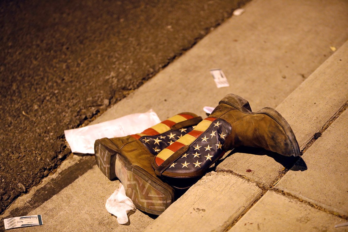A pair of cowboy boots is shown in the street outside the concert venue. REUTERS/Las Vegas Sun/Steve Marcus