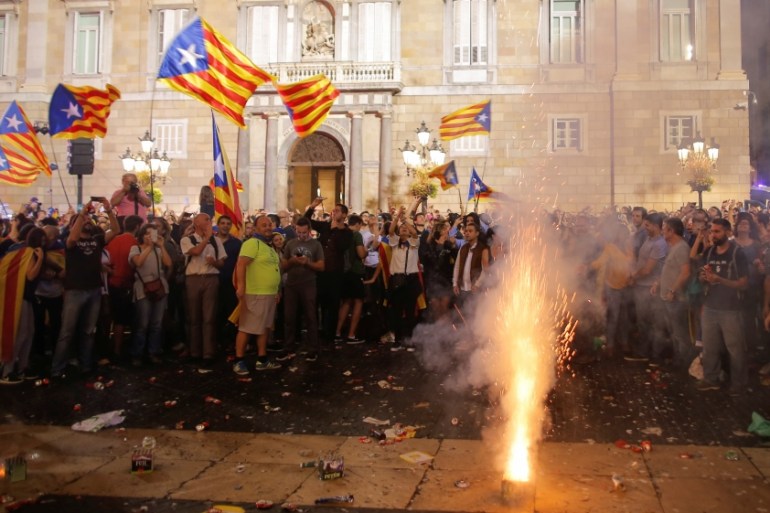 Fireworks are set off in front of the Catalan regional government headquarters during celebratrions after the Catalan regional parliament declared independence from Spain in Barcelona