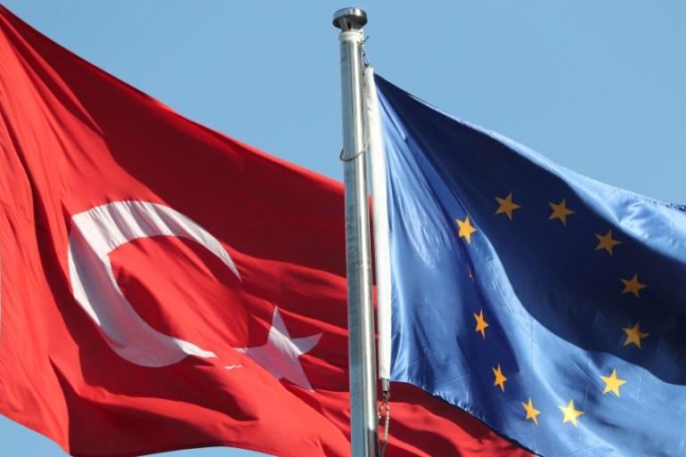 European Union and Turkish flags fly at the business and financial district of Levent in Istanbul