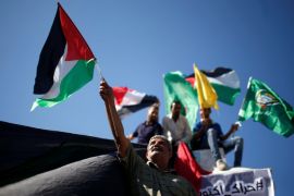 Palestinians celebrate after Hamas said it reached a deal with Palestinian rival Fatah, in Gaza City