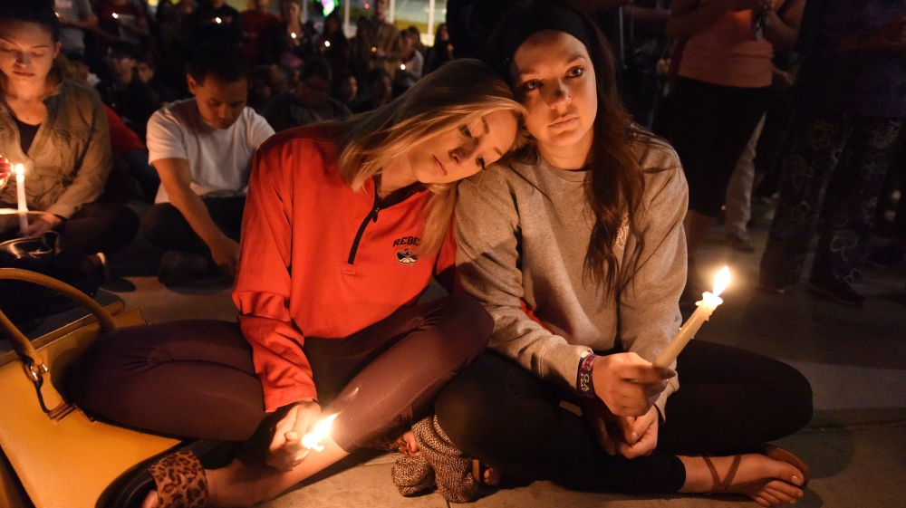 
People attend a candlelight vigil at the University of Las Vegas student union [Robyn Beck/AFP/Getty Images]








A candlelight vigil was held on the Las Vegas strip following the mass shooting [Chris Wattie/Reuters] 





A candlelight vigil was held on the Las Vegas strip following the mass shooting [Chris Wattie/Reuters] 