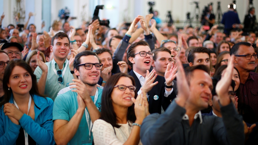 Joyous OVP supporters in Vienna react to the first exit polls [Dominic Ebenbichler/Reuters]