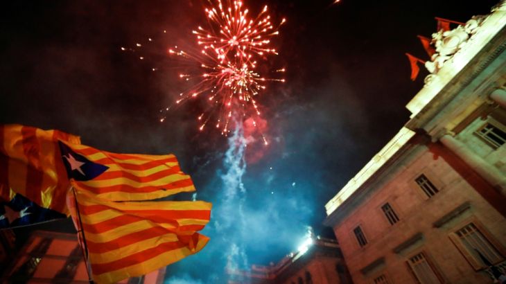 Fireworks go off in front of the Catalan regional government headquarters during celebratrions after the Catalan regional parliament declared independence from Spain in Barcelona