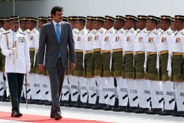 Qatar''s Emir Sheikh Tamim bin Hamad al-Thani inspects an honour guard during a state welcome ceremony at the Parliament House in Kuala Lumpur