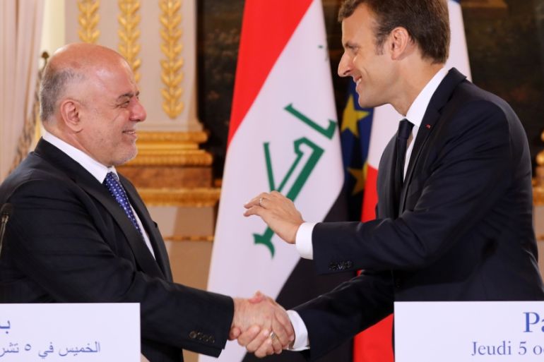 French President Emmanuel Macron and Iraqi Prime minister Haider Al-Abadi attend a joint news conference at the Elysee Palace in Paris