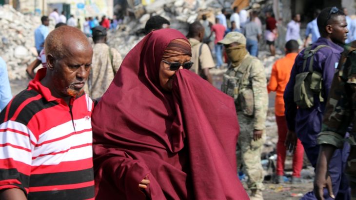 A Somali woman mourns at the scene of an explosion in KM4 street in the Hodan district of Mogadishu