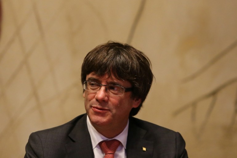 Catalan President Puigdemont presides over a cabinet meeting at Generalitat Palace in Barcelona