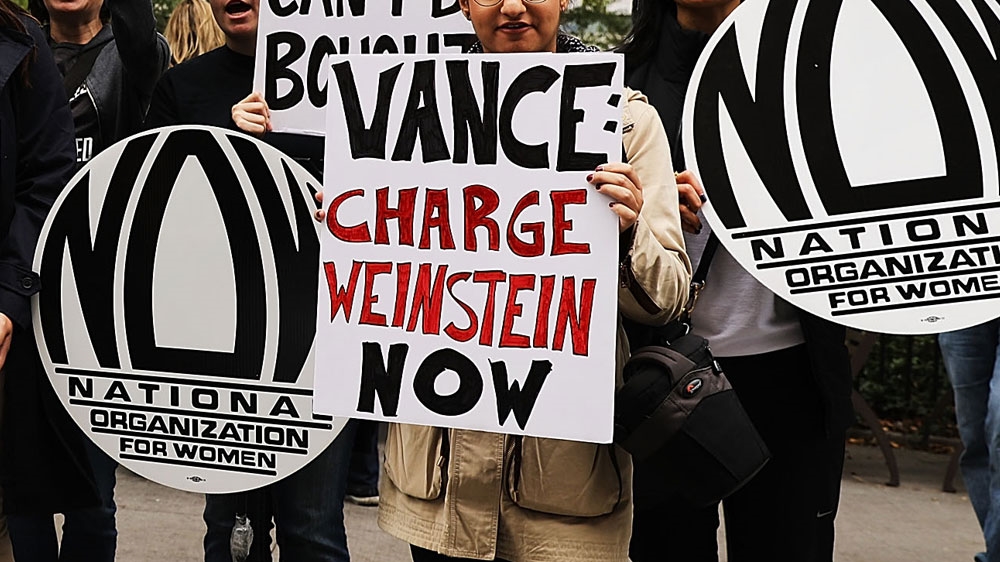 Members of the National Organization for Women (NOW) hold a news conference and demonstration outside of the Manhattan Criminal Court [File: Spencer Platt/AFP/Getty Images]